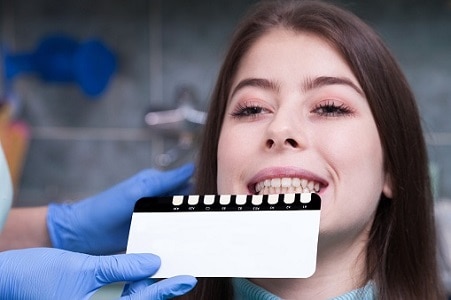 Doctor Treating The Patient A-Dental Center